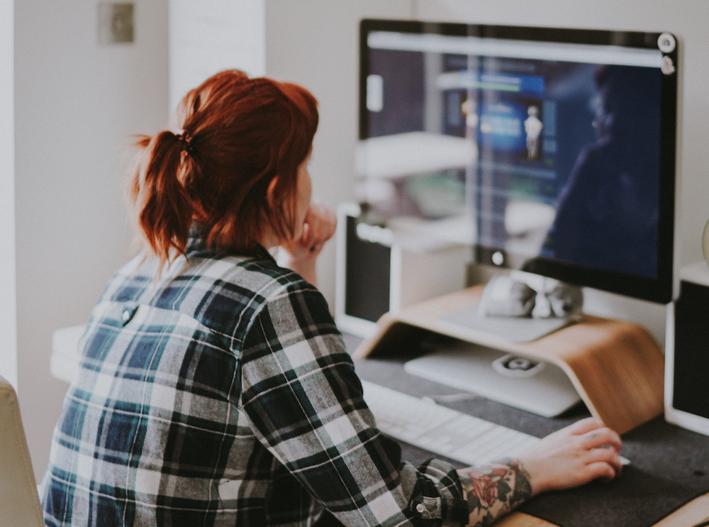 A woman uses a computer
