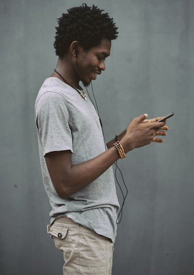 Young man listening to music on his phone